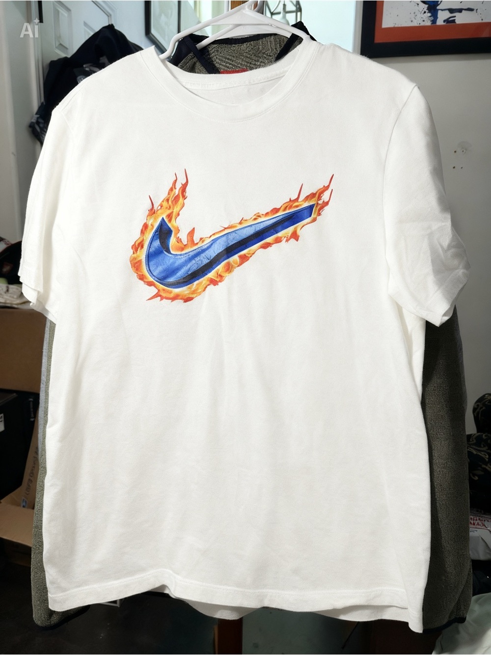 Nike Men's White Graphic T-Shirt with Flaming Blue Swoosh Logo
